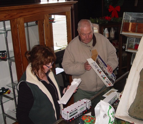 2011-03-05 Debby & Fred packing up her family’s Hess Truck collection display. DSC00295.jpg